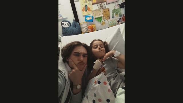 Video Reference: Photograph, People, Selfie, Snapshot, Photography, Fun, Room, Child, Smile, Finger, Person, Photo, Indoor, Woman, Looking, Refrigerator, Man, Front, Mirror, Young, Posing, Holding, Cellphone, Standing, Door, Phone, Girl, Dark, Wearing, White, Teeth, Shirt, Human face, Baby, Clothing, Text, Toddler