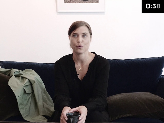 Video Reference: Sitting, Shoulder, Neck, Human, Photography, Footwear, Outerwear, White-collar worker, Photo shoot, Furniture