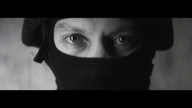 Video Reference: Face, Black, Personal protective equipment, Eye, Head, Nose, Black-and-white, Close-up, Mouth, Organ