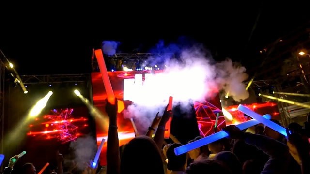 Video Reference: entertainment, concert, rock concert, stage, light, crowd, performance, event, night, festival, Person