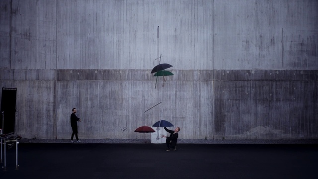 Video Reference: White, Wall, Red, Umbrella, Line, Sitting, Architecture, Concrete, Photography, Fashion accessory