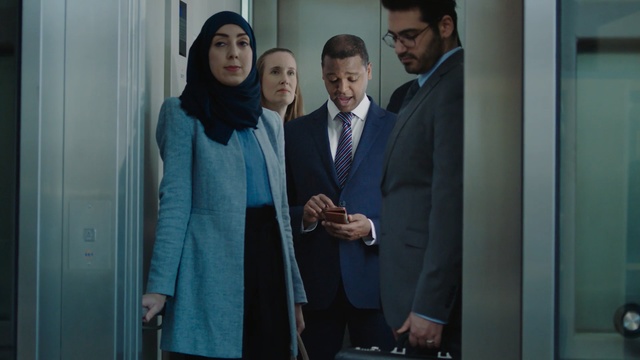 Video Reference: Suit, White-collar worker, Event, Room, Businessperson, Formal wear, Gentleman, Gesture, Smile, Person