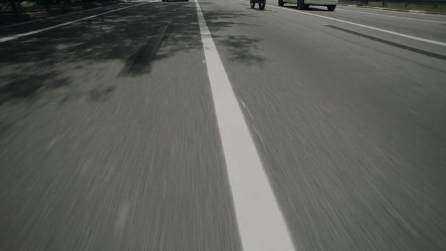 Video Reference: Asphalt, Road, Lane, Road surface, Mode of transport, Thoroughfare, Infrastructure, Line, Floor, Highway