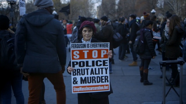 Video Reference: protest, crowd, demonstration, event, street, public event, winter, tree, Person