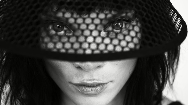 Video Reference: black, black and white, nose, monochrome photography, photography, headgear, close up, eye, black hair, smile