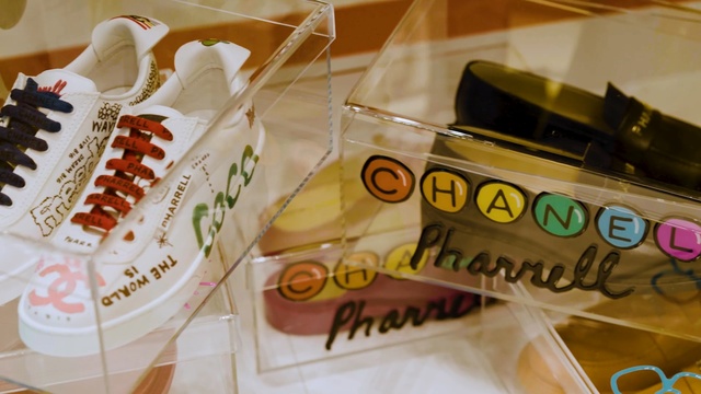 Video Reference: Footwear, Shoe, Comfort food, Table, Indoor, Cake, Food, Sitting, Cup, Coffee, Paper, Topped, Plate, Decorated, Birthday, Fruit, Computer, Counter, Cutting, Covered, Wooden, White, Keyboard, Sandwich, Handwriting, Text