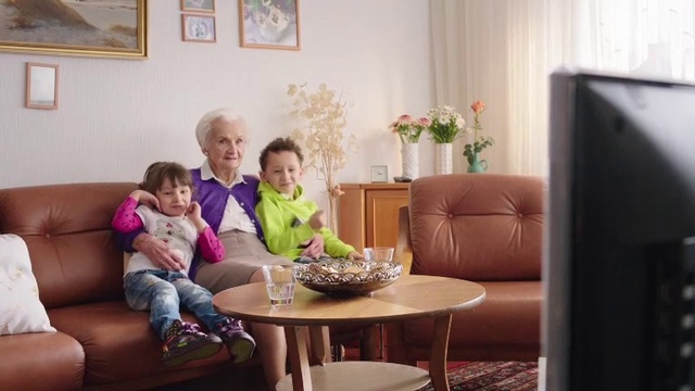 Video Reference: Living room, Room, Couch, Furniture, Interior design, Property, Child, Sofa bed, Table, Home