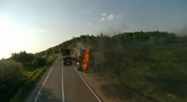 Video Reference: Road, Atmospheric phenomenon, Highway, Lane, Morning, Freeway, Geological phenomenon, Mode of transport, Asphalt, Infrastructure, Outdoor, Scene, Grass, Track, Train, Stop, View, Driving, Traffic, Green, Coming, Car, Sign, Street, Traveling, Railroad, Red, Yellow, Clouds, Country, Side, Rain, Blurry, Forest, Field, Smoke, Way, Sky, Vehicle, Land vehicle, Tree, Fog, Cloud, Day, Distance