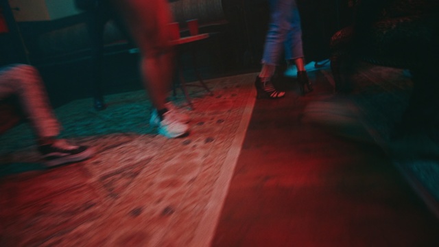 Video Reference: Red, Light, Floor, Flooring, Leg, Room, Human body, Fun, Performance, Night, Person, Indoor, Building, Child, Playing, Sitting, Man, Living, Girl, Holding, Young, Riding, Boy, Woman, Little, Standing, Board, Game, Rain, Group, People, Rug, Blurry, Video, Dance, Footwear, Clothing