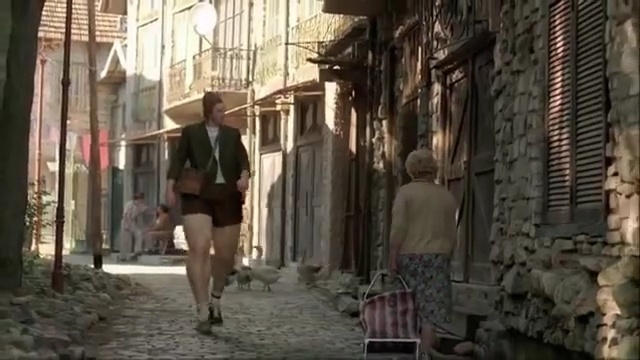 Video Reference: Alley, Street, Neighbourhood, Town, Human settlement, Snapshot, Mode of transport, Pedestrian, Infrastructure, Road, Person
