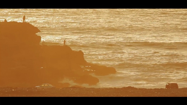 Video Reference: body of water, sky, horizon, sea, shore, calm, water, wave, ocean, sunset, Person