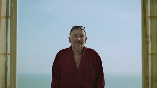 Video Reference: man, standing, sky, outerwear, vacation, wood, fun, facial hair, window, Person