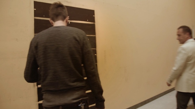 Video Reference: standing, outerwear, art gallery, design, tourist attraction, exhibition, art exhibition, museum