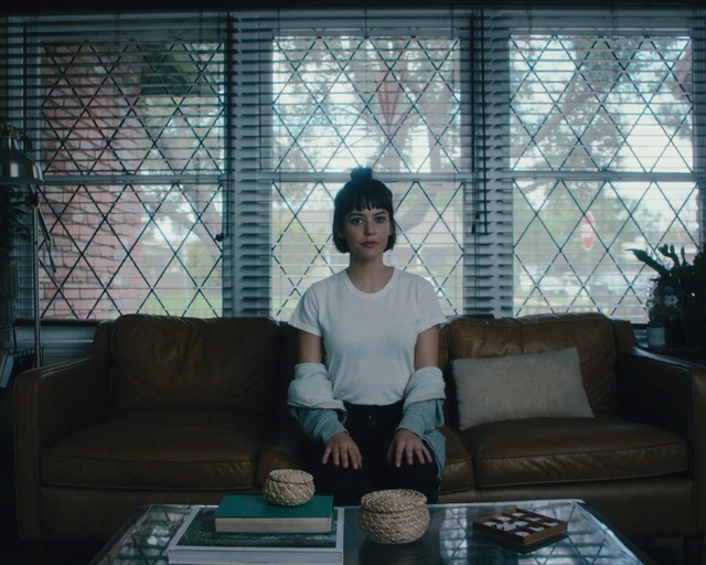 Video Reference: sitting, room, window, furniture, interior design, girl, house, couch, home, angle, Person