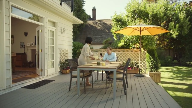 Video Reference: Deck, Property, Backyard, Yard, Patio, Home, House, Outdoor table, Umbrella, Furniture