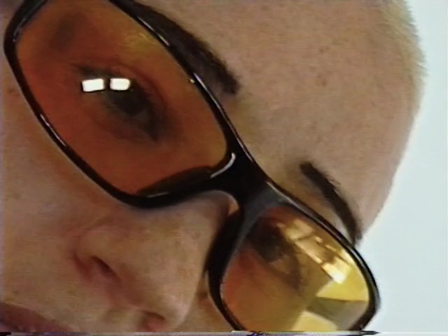 Video Reference: eyewear, face, nose, glasses, eyebrow, vision care, chin, close up, eye, goggles, Person