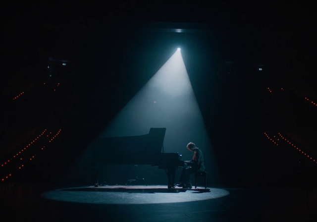 Video Reference: Stage, Light, Performance, Lighting, Sky, Performing arts, Darkness, Music venue, Night, Event, Dark, Table, Lit, Large, Sun, Water, Air, White, Plane, Man, Room, Smoke, Concert, Piano, Night sky