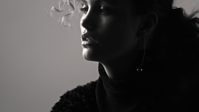 Video Reference: Face, Black, Hair, White, Photograph, Black-and-white, Lip, Beauty, Monochrome photography, Monochrome, Person, Looking, Standing, Holding, Woman, Front, Staring, Camera, Man, Young, Wearing, Glasses, Mirror, Room, Shirt, Human face, Portrait, Black and white