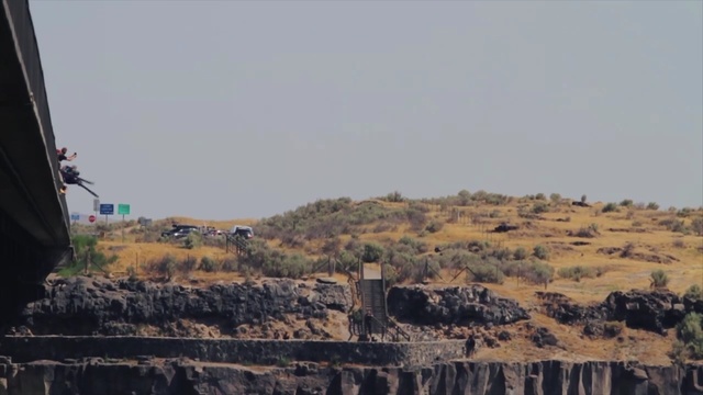 Video Reference: sky, rural area, terrain, village, rock, tree, escarpment, badlands, hill, ecoregion