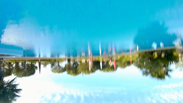 Video Reference: Reflection, Sky, Nature, Water, Blue, Daytime, Water resources, Natural landscape, Reflecting pool, Cloud