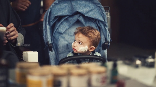 Video Reference: Child, Human, Fun, Photography, Toddler, Baby, Person, Indoor, Table, Sitting, Boy, Man, Looking, Food, Front, Young, Little, Using, Woman, Holding, Restaurant, Standing, Cake, People, Human face, Clothing