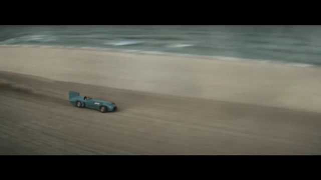 Video Reference: racer, car, motor vehicle, sand, speed, wheeled vehicle, vehicle, sky, sunset, road