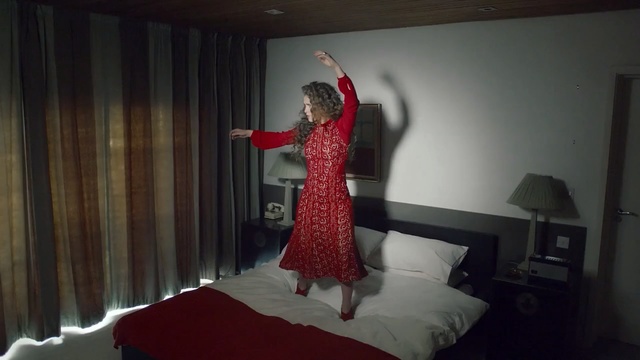 Video Reference: Bed, Room, Dress, Bedroom, Textile, Furniture, Interior design, Performance art, Curtain, Costume