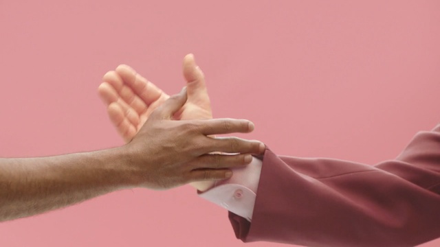 Video Reference: Hand, Finger, Gesture, Pink, Arm, Thumb, Sign language, Nail, High five, Wrist