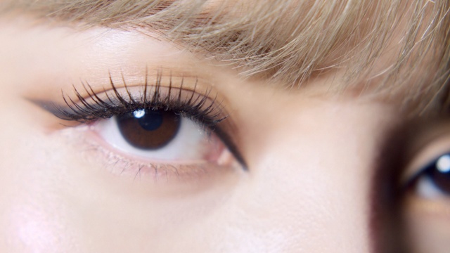 Video Reference: Eyebrow, Face, Eyelash, Eye, Hair, Skin, Close-up, Iris, Organ, Nose, Person, Thing, Indoor, Toiletry, Wearing, Eyes, Mouth, Close, Teeth, Looking, Brushing, Camera, Black, Staring, Glasses, Young, Girl, Toothbrush, Brush, Head, Neck, Bite, Red, Brown, Little, Eating, Blue, Pair, Donut, Woman, Bow, White, Cosmetics, Lipstick, Eye shadow, Mascara, Eyelash extensions, Eye liner, Cosmetic, Lip