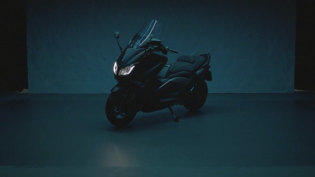 Video Reference: Black, Scooter, Motor vehicle, Motorcycle, Headlamp, Vehicle, Mode of transport, Automotive design, Automotive lighting, Photography