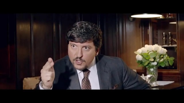 Video Reference: Suit, Facial expression, Formal wear, Tuxedo, Speech, Smile, Conversation, White-collar worker, Interaction, Businessperson