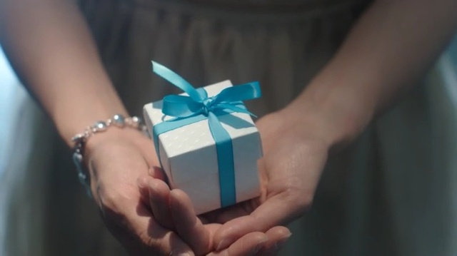 Video Reference: Blue, Turquoise, Present, Ribbon, Gift wrapping, Hand, Teal, Finger, Turquoise, Ring
