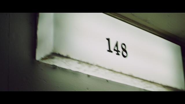 Video Reference: Green, White, Photograph, Text, Font, Snapshot, Wall, Number, Close-up, Automotive exterior