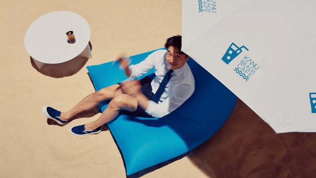 Video Reference: Leg, Illustration, Furniture, Sun tanning, Person, Table, Indoor, Sitting, Woman, Man, Monitor, Young, Holding, Computer, Ball, Desk, Girl, Laying, Screen, Blue, Sign, Phone, Playing, White, Standing, Swinging, Court, Cat, People, Player, Soccer, Bed, Shirt, Room, Game, Clothing, Text, Human face