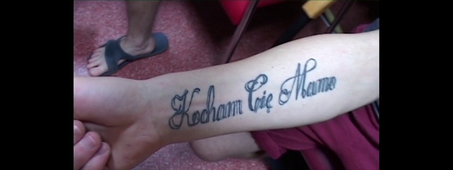 Video Reference: Font, Tattoo, Arm, Text, Finger, Joint, Hand, Wrist, Human leg, Calligraphy, Person, Indoor, Holding, Small, Sitting, Birthday, Baby, Cake, Table, Child, Girl, Little, Young, Woman, Boy, Man, Plate, White, Bed, Cat, Stuffed, Laying, Playing, Handwriting, Ink, Abstract, Temporary tattoo, Flesh