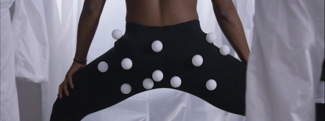 Video Reference: White, Polka dot, Pattern, Clothing, Waist, Design, Dance, Abdomen, Event, Music