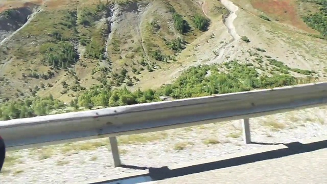 Video Reference: Mountain pass, Mountainous landforms, Road, Guard rail, Geological phenomenon, Infrastructure, Mountain, Hill station, Thoroughfare, Mountain range
