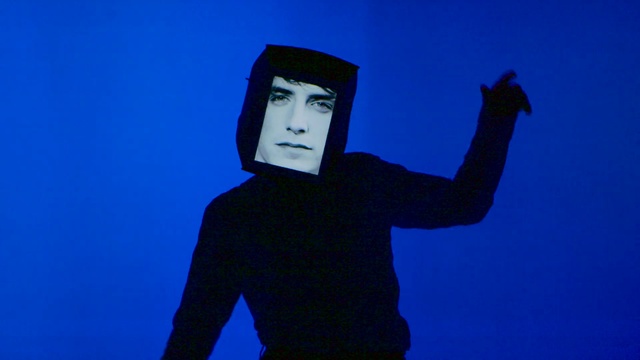 Video Reference: Finger, Electric blue, Headgear, Hand, Gesture, Fictional character