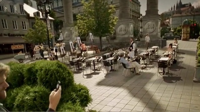 Video Reference: town, tree, neighbourhood, street, city, pedestrian, outdoor structure, downtown, recreation, plant