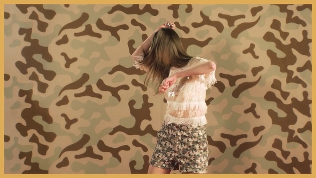 Video Reference: Pattern, Wall, Wallpaper, Military camouflage, Camouflage, Design, Room, Tree, Textile, Clothing, Shirt, Young, Curtain, Man, Text, Dress, Girl, Person, Skirt, Human face