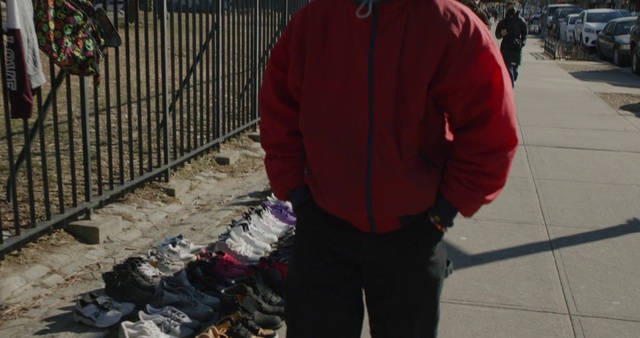 Video Reference: Product, Sleeve, Fence, Street fashion, Jacket, Luggage and bags, Bag, Asphalt, T-shirt, Tree