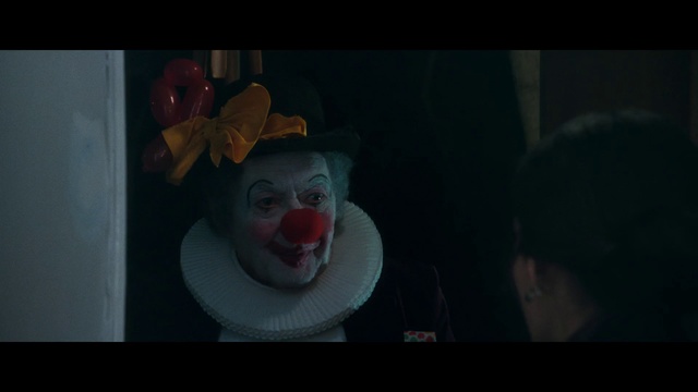 Video Reference: Clown, Fiction, Darkness, Performing arts, Smile, Fictional character, Art, Supervillain