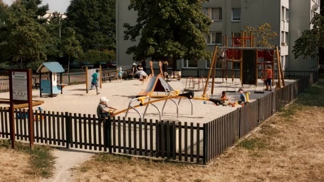 Video Reference: public space, fence, recreation, outdoor structure, backyard, yard, playground, deck, home fencing, park, Person