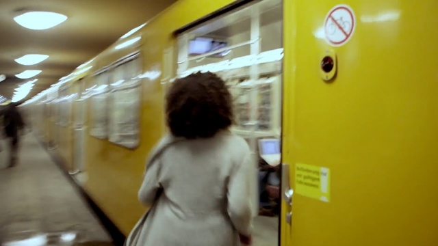 Video Reference: yellow, snapshot, standing, public transport, girl, fun, Person