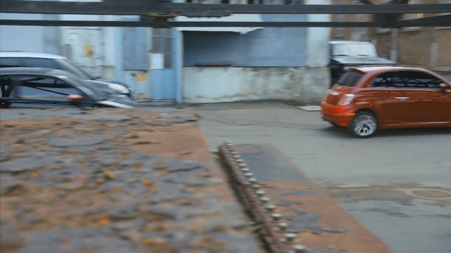 Video Reference: car, motor vehicle, vehicle, public space, mode of transport, vehicle door, city car, parking, road, street