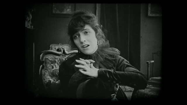 Video Reference: Black, Photograph, Portrait, Black-and-white, Monochrome, Sitting, Photography, Lady, Monochrome photography, Snapshot, Person, Young, Girl, Looking, Photo, Holding, Boy, Man, Front, Dark, White, Little, Woman, Computer, Phone, Bus, Bed, Human face, Black and white, Clothing, Text, Smile