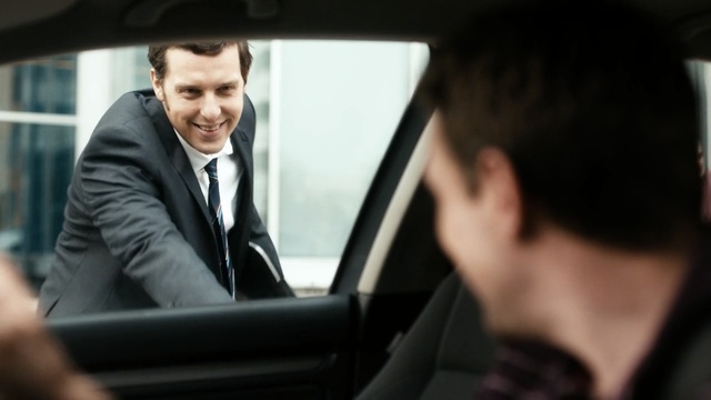 Video Reference: car, vehicle, luxury vehicle, motor vehicle, automotive design, family car, technology, driving, businessperson, suit, Person