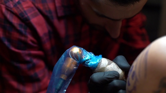 Video Reference: Arm, Hand, Joint, Finger, Tattoo, Flesh, Fictional character, Nail