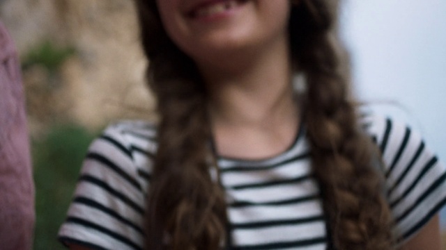 Video Reference: Hair, Face, Facial expression, Hairstyle, Lip, Long hair, Beauty, Nose, Eyebrow, Brown hair