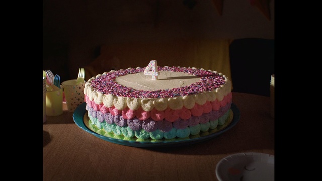 Video Reference: Cake, Food, Cake decorating, Buttercream, Fondant, Sugar paste, Icing, Dessert, Royal icing, Sweetness, Indoor, Table, Birthday, Lit, Sitting, Cup, Pink, Decorated, Small, Front, White, Woman, Plate, Standing, Red, Birthday cake, Baked goods, Wedding cake, Sugar cake, Candle, Torte, Cake stand, Cake decorating supply, Kuchen, Muffin, Baking, Whipped cream, Cream, Cupcake, Baking cup